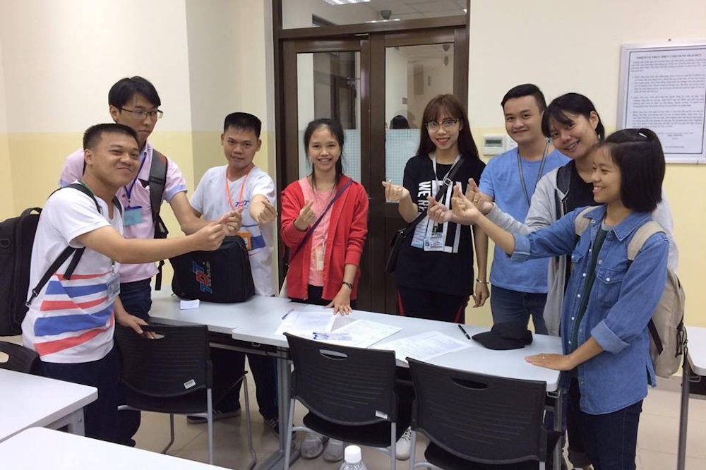 Group 1 consists of students from Vietnam, Japan, Korea, Thailand and Laos making the heart icon expressing the spirit of solidarity and determination